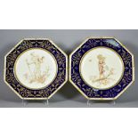 A Pair of Wedgwood Porcelain Octagonal Plates, with white, blue and gilt borders, the centres