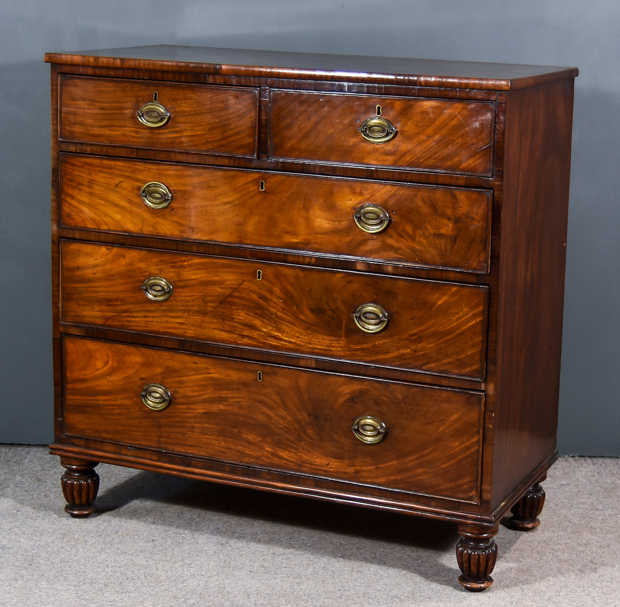 A George III Mahogany Chest, with square edge to top, fitted two short and three long graduated