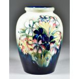 A Moorcroft Pottery Baluster-Shaped Vase, tube-lined and decorated in colours with 'Spring