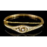 A Diamond and Seed Pearl Bracelet, 20th Century, set with central brilliant cut white diamond,