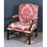 A Mahogany Gainsborough Library Armchair of "George III" Design, with arched back, upholstered in