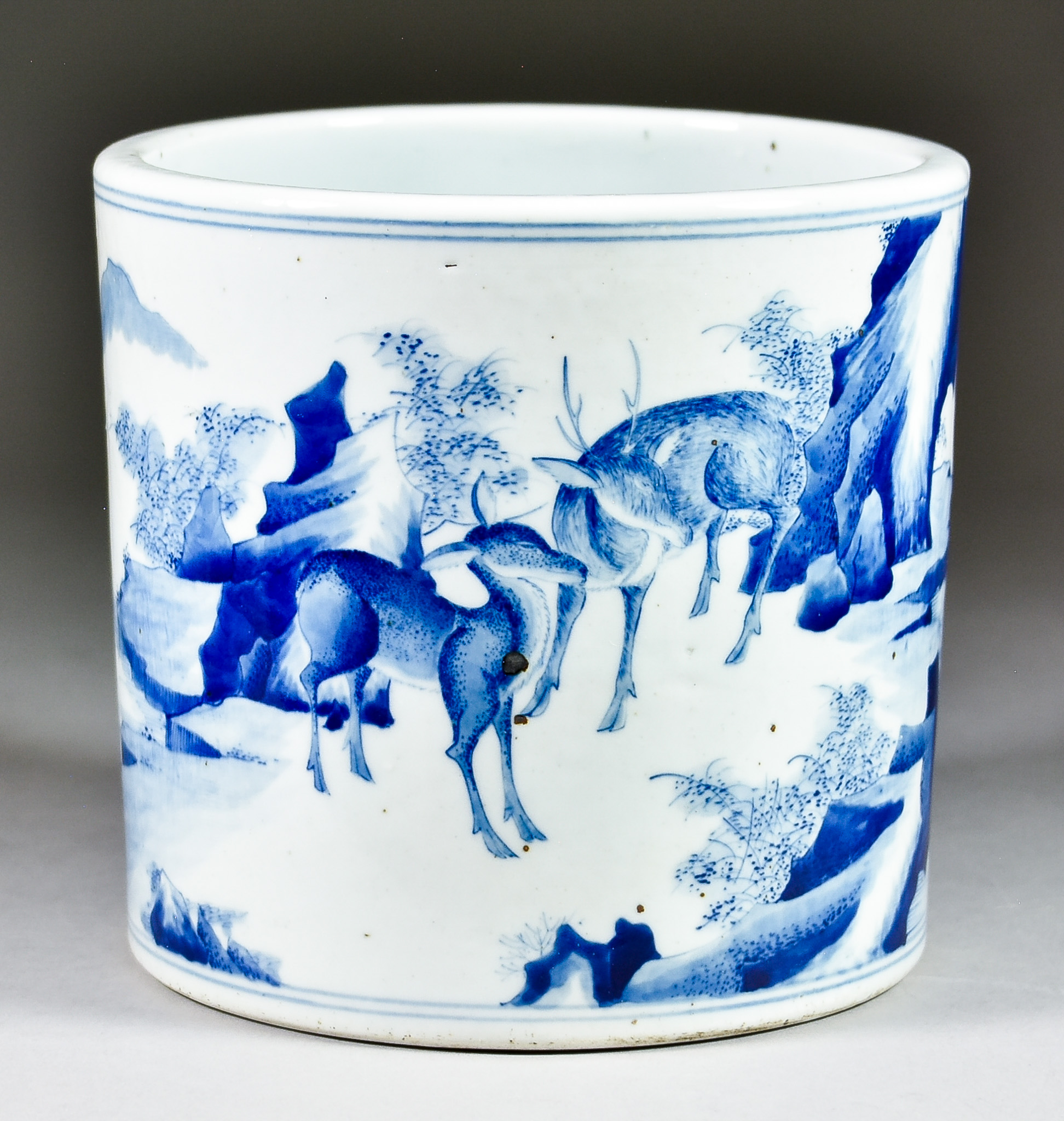 A Chinese Blue and White Porcelain Cylindrical Brush Pot, 20th Century, decorated with two deer in a