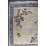 A Modern Chinese Picture Carpet, woven in colours of ivory, pale blue, fawn and rose, the field
