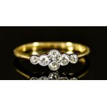 An 18ct Gold Six Stone Diamond Ring, 20th Century, set with six small brilliant cut diamonds,