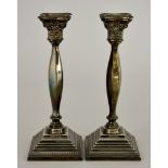 A Pair of Elizabeth II Silver Candlesticks, by A. Taite & Sons Ltd. London 1965, with bead mounts,