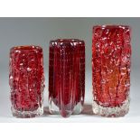 Three Geoffrey Baxter for Whitefriars Glass Vases in Ruby, one with lobed body with controlled