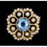 A 15ct Gold Seed Pearl and Blue Topaz Brooch, 20th Century, set with a centre topaz stone,