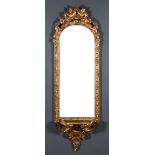 A Pair of Late 19th Century Gilt Framed Rectangular Wall Mirrors, the arched tops with bold leaf and