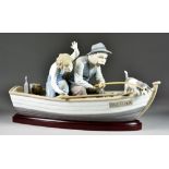 A Lladro Porcelain Figure No.5215 - 'Fishing with Gramps' 5.5ins wide x 15.25ins long x 8.5ins high,