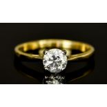 An 18ct Gold Solitaire Diamond Ring, Modern, set with a centre brilliant cut white diamond,