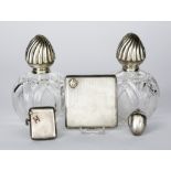 A Victorian Silver Acorn Shaped Vinaigrette, a Pair of Silver Topped Glass Scent Bottles, a Silver