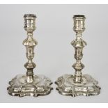 A Pair of George II Cast Silver Candlesticks, by Richard Gosling, London 1740, with knopped stems,