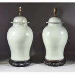 A Pair of Chinese Celadon Glazed Baluster-Shaped Vases and Covers, 20th Century, converted to