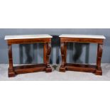 A Pair of George IV Figured Mahogany Pier Tables, with white marble slabs to top, each with