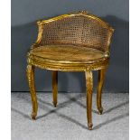 A 19th Century French Gilt Framed Oval Stool, the shaped back with floral cresting, bergere panelled