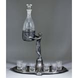 A WMF Liqueur Set Stand, Early 20th Century, with six recesses for the glasses and classical