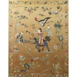 A Chinese Embroidered Panel worked with a figure astride a lion dog with two attendants, bats,