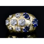 A Sapphire and Diamond Cluster Ring, Modern, yellow metal (tests as 18ct), set in an abstract