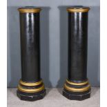 A Pair of Black and Gilt Painted Circular Pedestals, with moulded edges to top, on turned bases,