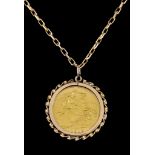 A George V 1913 Half Sovereign, set in 9ct gold mount suspended from 9ct gold chain, 550mm