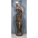 19th Century French School - Cast iron - Bronzed figure of a classical beauty holding a torch, on