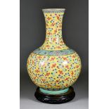 A Chinese Porcelain Bottle Vase, 20th Century, decorated with bats, flowers and scrolls on a