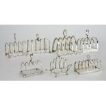 An Edward VIII Silver Six Division Toast Rack and Six, Four Division Toast Racks, the six division