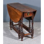 An Early 18th Century Walnut Oval Gateleg Table, fitted one frieze drawer, on turned supports with