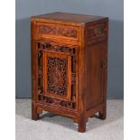 A Modern Chinese Panelled and Carved Hardwood Bedside Cabinet, fitted one frieze drawer and cupboard