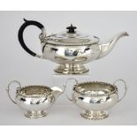 A George V Silver Circular Three-Piece Tea Service, by Walker & Hall, Sheffield 1918, the bulbous