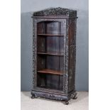 A Chinese Rosewood Dwarf Display Cabinet/Bookcase, the whole carved with dragons, clouds and leaves,