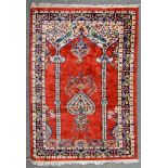 A 20th Century Hammadan Prayer Rug, woven in colours of ivory, pastel blue and wine, the field