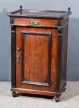 A Late Victorian Walnut and Ebonised Dwarf Cabinet, with turned finials to top, fitted one frieze