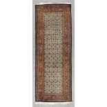 An Early 20th Century Hamadan Runner, woven in colours of ivory, navy blue, wine and green, the