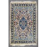 A 20th Century Tabriz Rug woven in pastel shades, the bold central stylised floral medallion and
