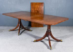 A George III Mahogany Extending Dining Table, with square edge to top, with two extra leaves, on