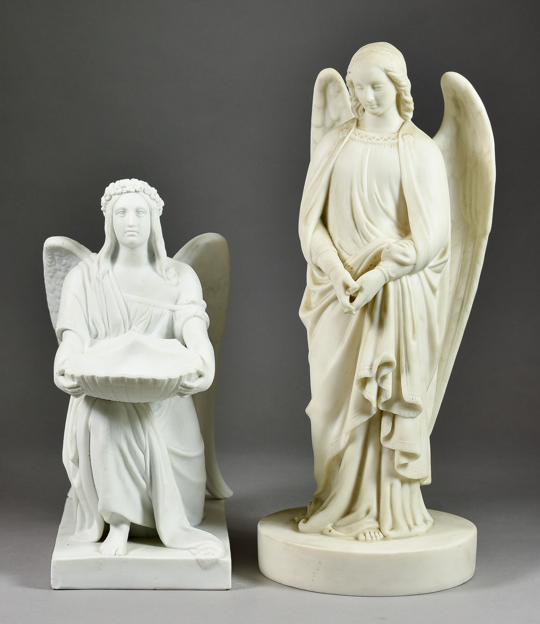 A Bing & Grondahl Bisque Figure after Thorvaldsen, 19th Century, of a kneeling angel supporting a