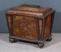 An Early 19th Century Mahogany Cellarette of Sarcophagus Form, with rectangular reeded panel to lid,