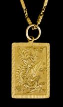 A 22ct Gold Pendant, in the form of a dragon, 38mm x 26mm, suspended on 22ct gold chain, 740mm in