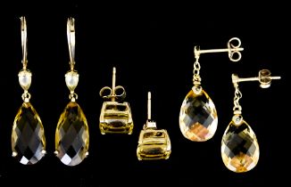 Three Pairs of 9ct Gold Earrings, for pierced ears, each set with faceted yellow stones, total gross