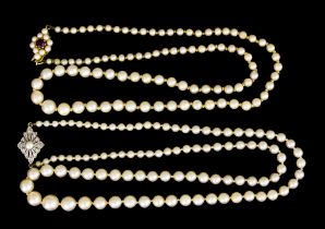 Two Strings of Cultured Pearls, one with gem set 9ct gold clasp, 460mm overall, the other with an