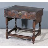 An Old Oak Bible Box, with moulded edge to lifting top, on bobbin turned supports, with plain H-