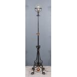 A Wrought Iron Adjustable Electric Standard Lamp, on four scroll supports, and shade for same, 73ins