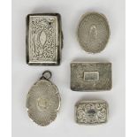 A Victorian Silver Oval Vinaigrette and Four Others, the oval by James Fenton, Birmingham 1864, of