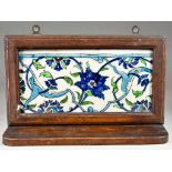 A Damascus Pottery Rectangular Border Tile, 18th Century, painted in blues and greens with