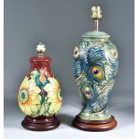 Two Moorcroft Pottery Table Lamps on Wooden Bases, one decorated in Peacock pattern, 12ins high