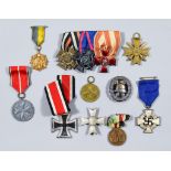 A Selection of World War II German Medals and Other Items Note: Condition reports not available on