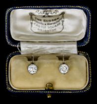 A Pair of Solitaire Diamond Stud Earrings, Early 20th Century, for non-pierced earrings, each