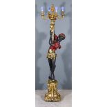 A 20th Century Italian Painted and Gilt Composition Blackamoor Candelabra, with four out scrolled