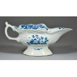 A Worcester Blue and White Press-Moulded Porcelain Sauce Boat, Circa 1755, painted with "the